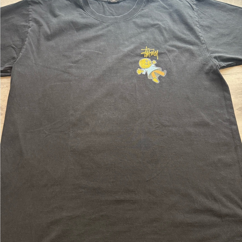 Stussy Black Tee with Yellow Cartoon Graphic
